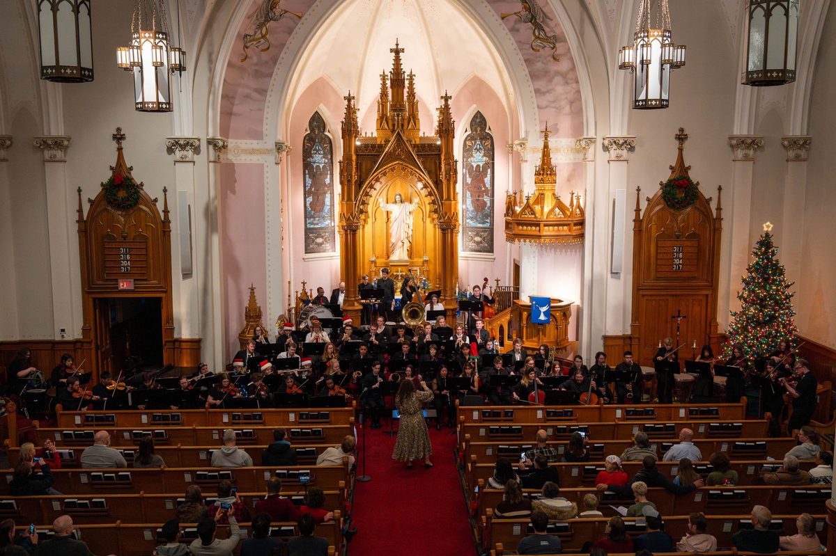 Performance inside a stone church interior, the kind of intimate Antigel church concert held around Geneva