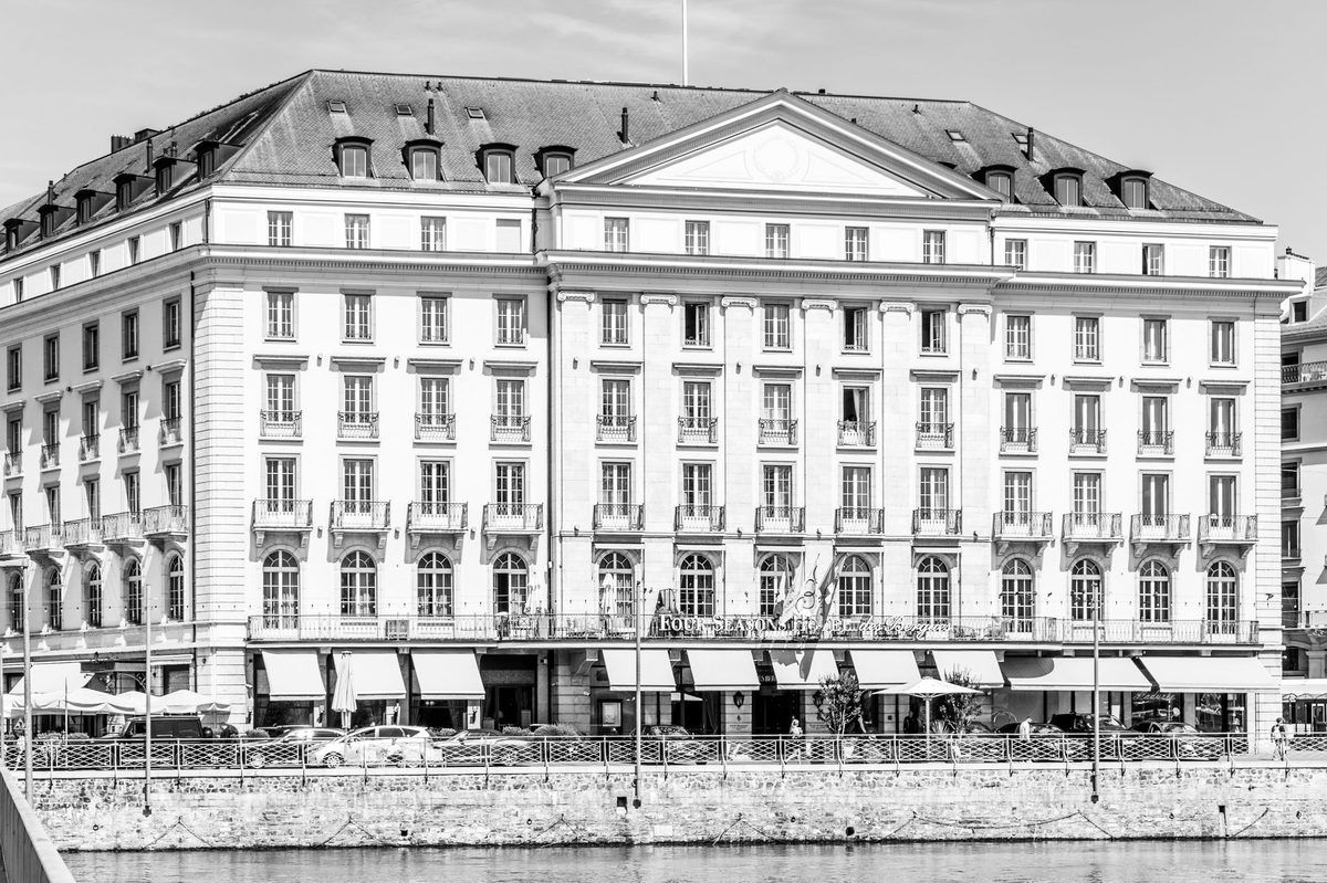 Lakefront grand hotel facade in Geneva, home to the best luxury hotels in Geneva