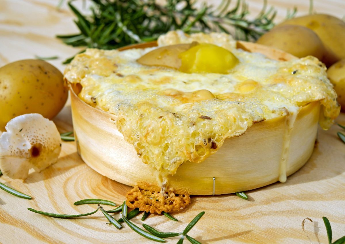 Best raclette in Geneva, melted Swiss cheese scraped over hot potatoes