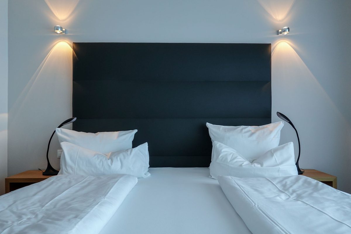 A clean budget hotel room near Geneva with a double bed