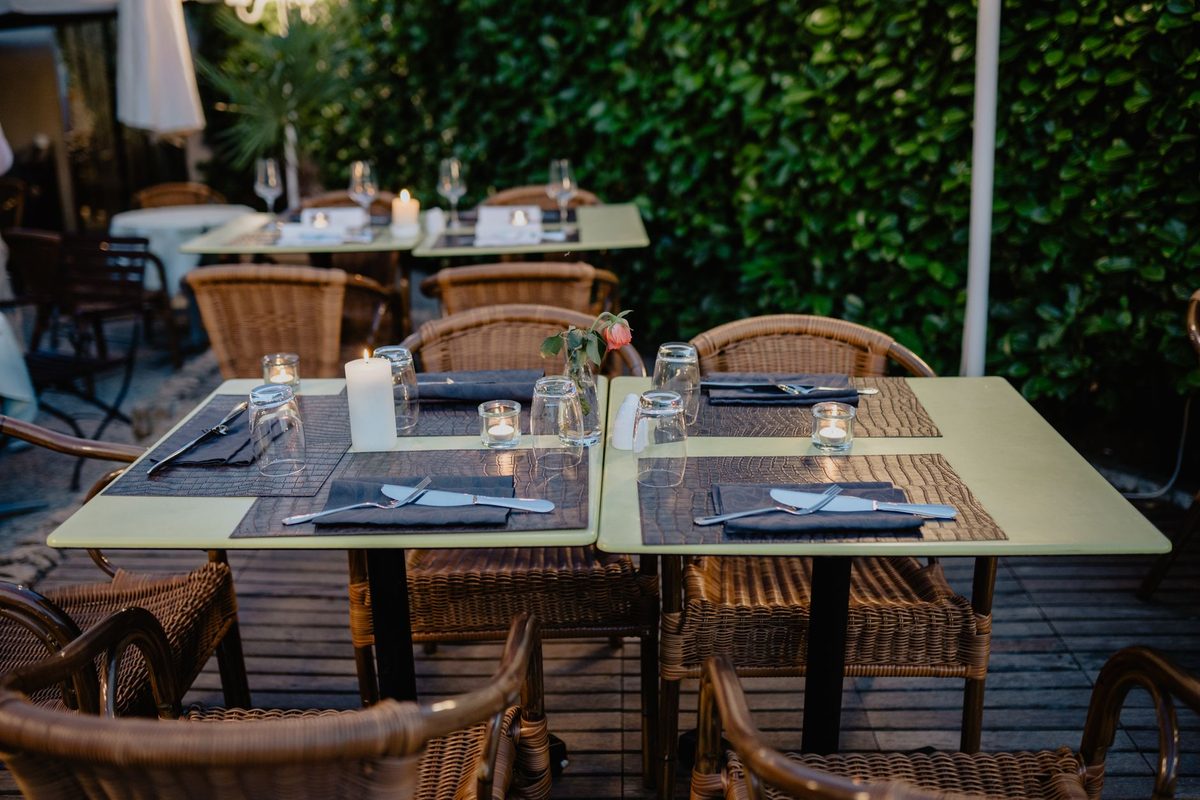 Courtyard terrace set for outdoor dining in Carouge, Geneva
