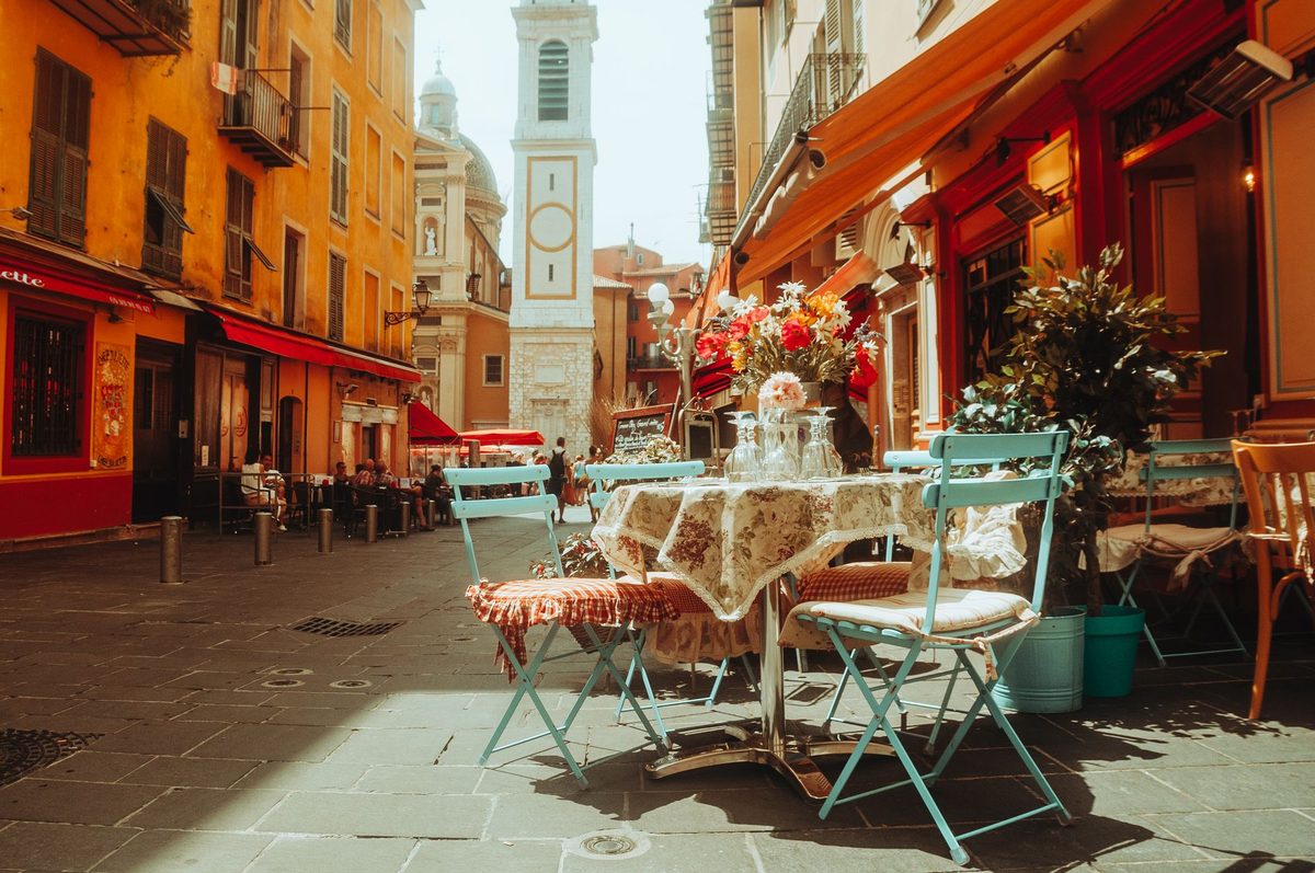 Sunny cafe terrace on a Mediterranean-style square in Carouge, Geneva