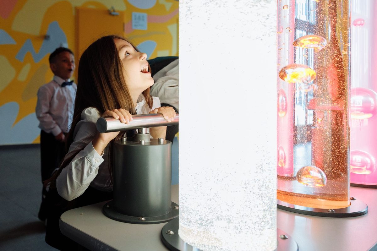 Children exploring hands-on science exhibits at CERN in Geneva