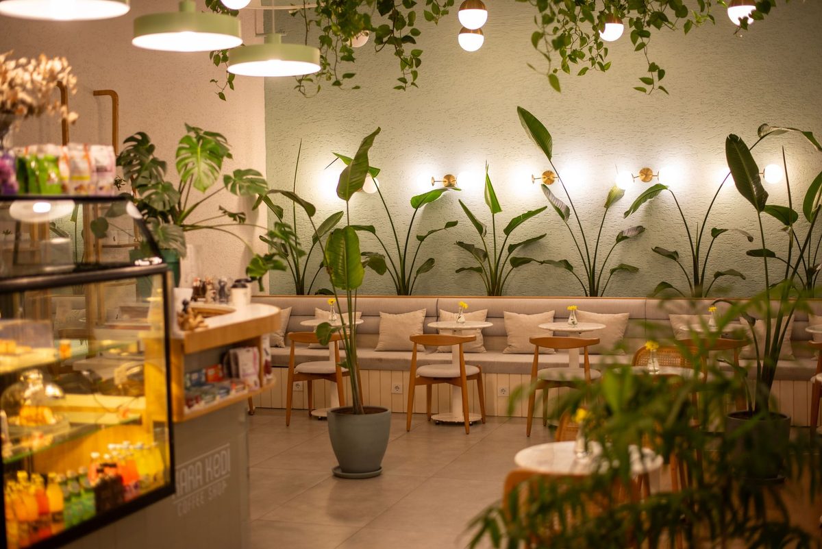 Plant-filled neighbourhood cafe interior in Geneva