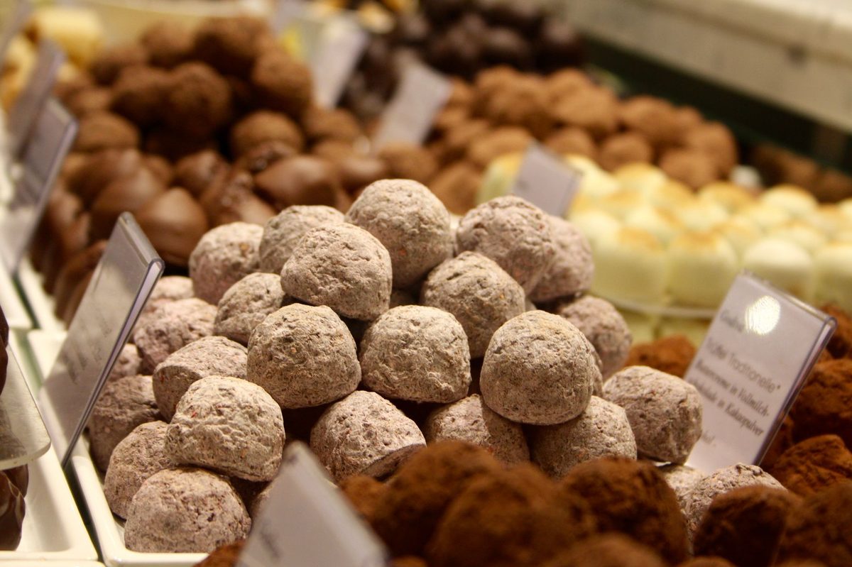 Assorted chocolate truffles in a Geneva chocolate shop display