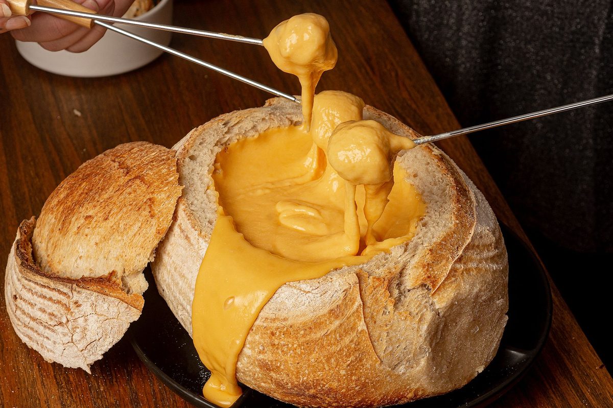 Swiss fondue shared at a table, a family-friendly meal in Geneva