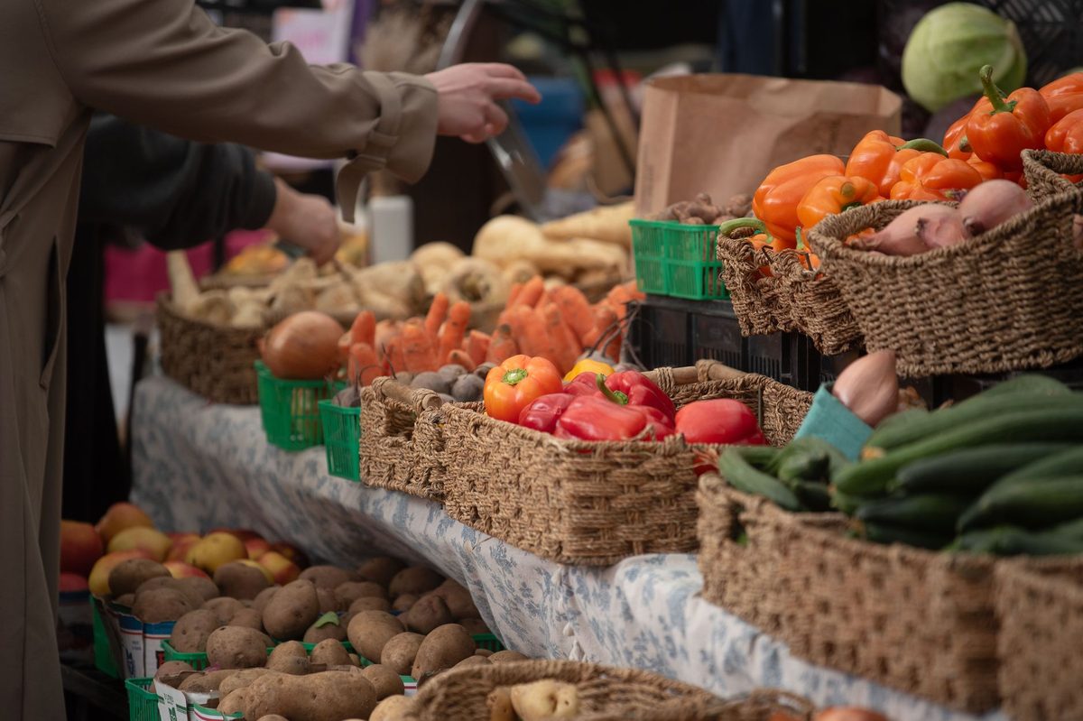 Fresh produce on display at a Geneva farmers market stall