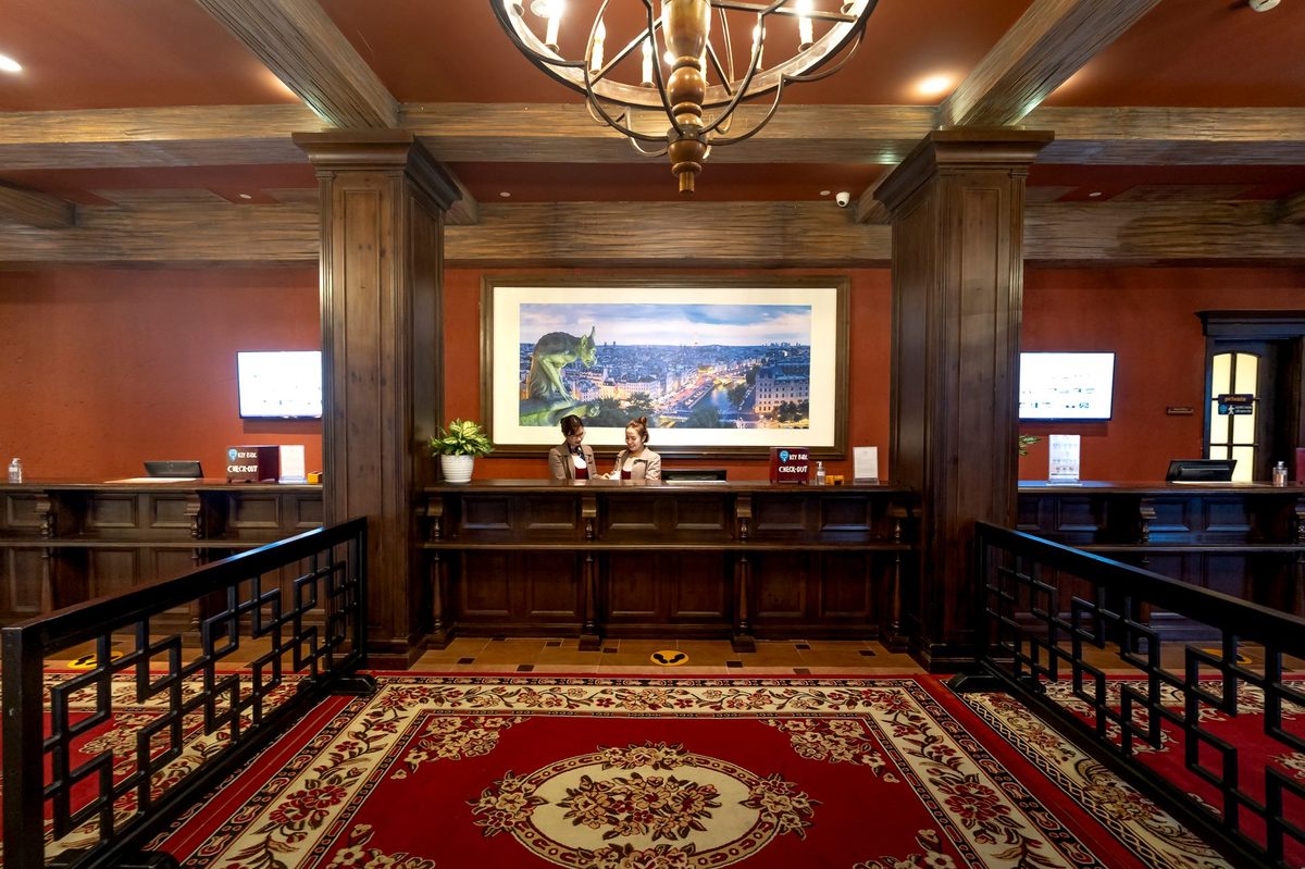 A family checking in at a Geneva hotel reception