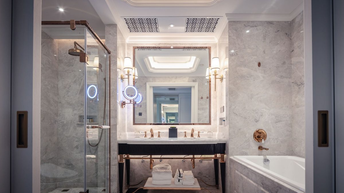 Marble bathroom in a modern luxury hotel suite, typical of Geneva five-star rooms