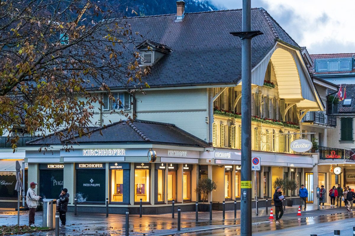 A luxury Swiss watch boutique window on Geneva's Rue du Rhone