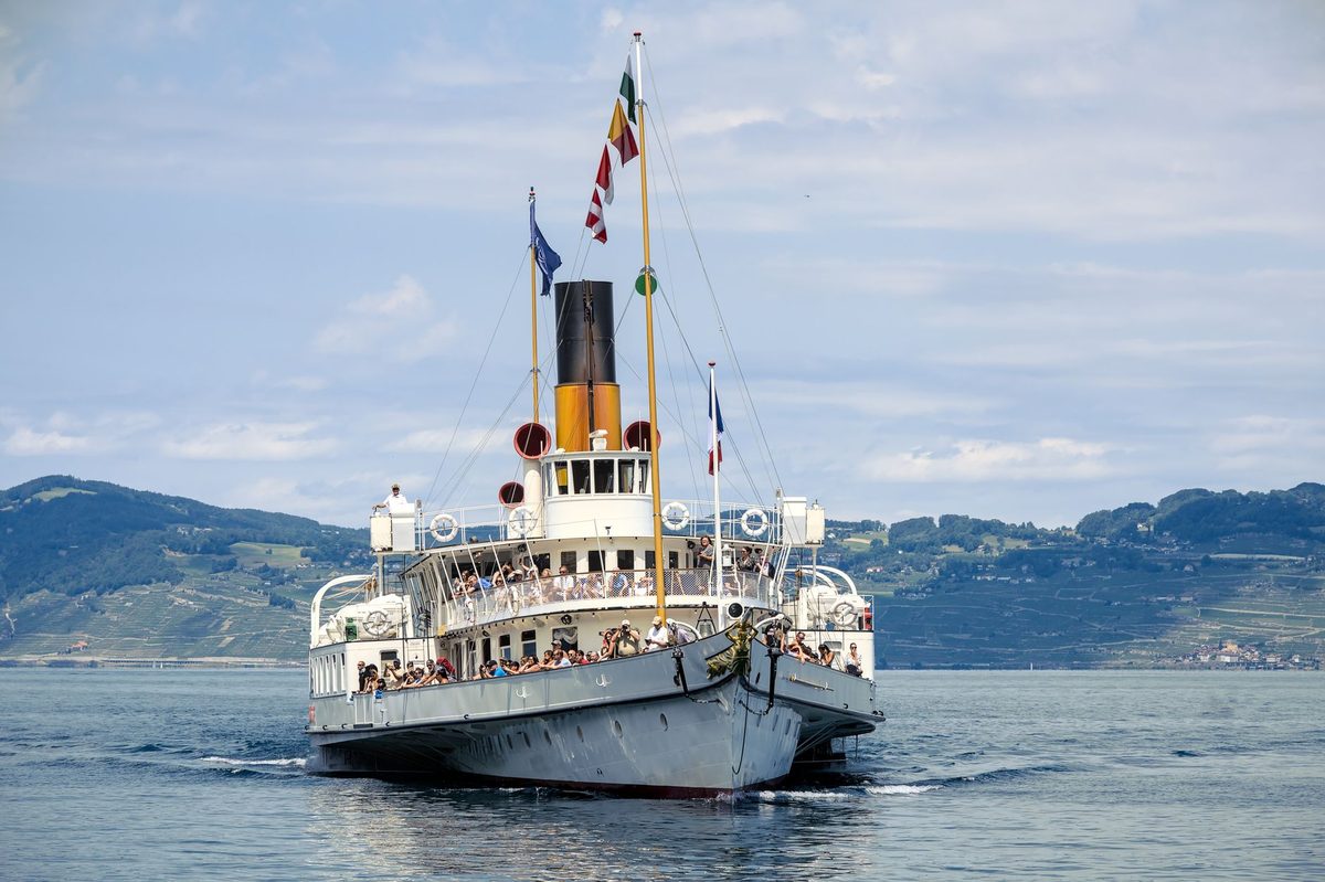 A yellow Mouettes water taxi crossing Lake Geneva, a toddler favourite