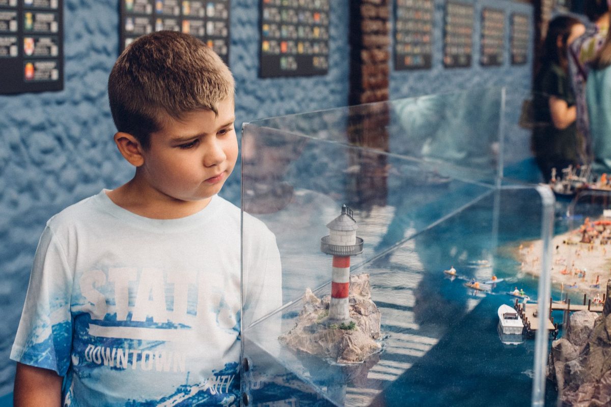Curious kids exploring a museum display in Geneva