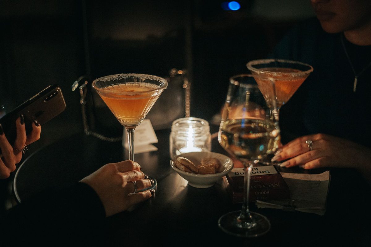 An evening cocktail bar crowd in the Paquis nightlife district of Geneva