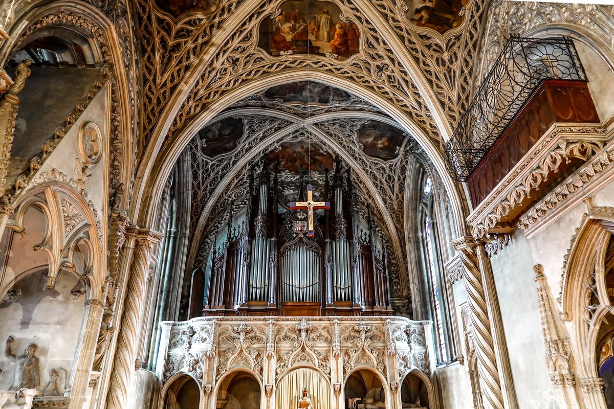 The plain Protestant interior of Saint-Pierre Cathedral, Calvin's church in Geneva