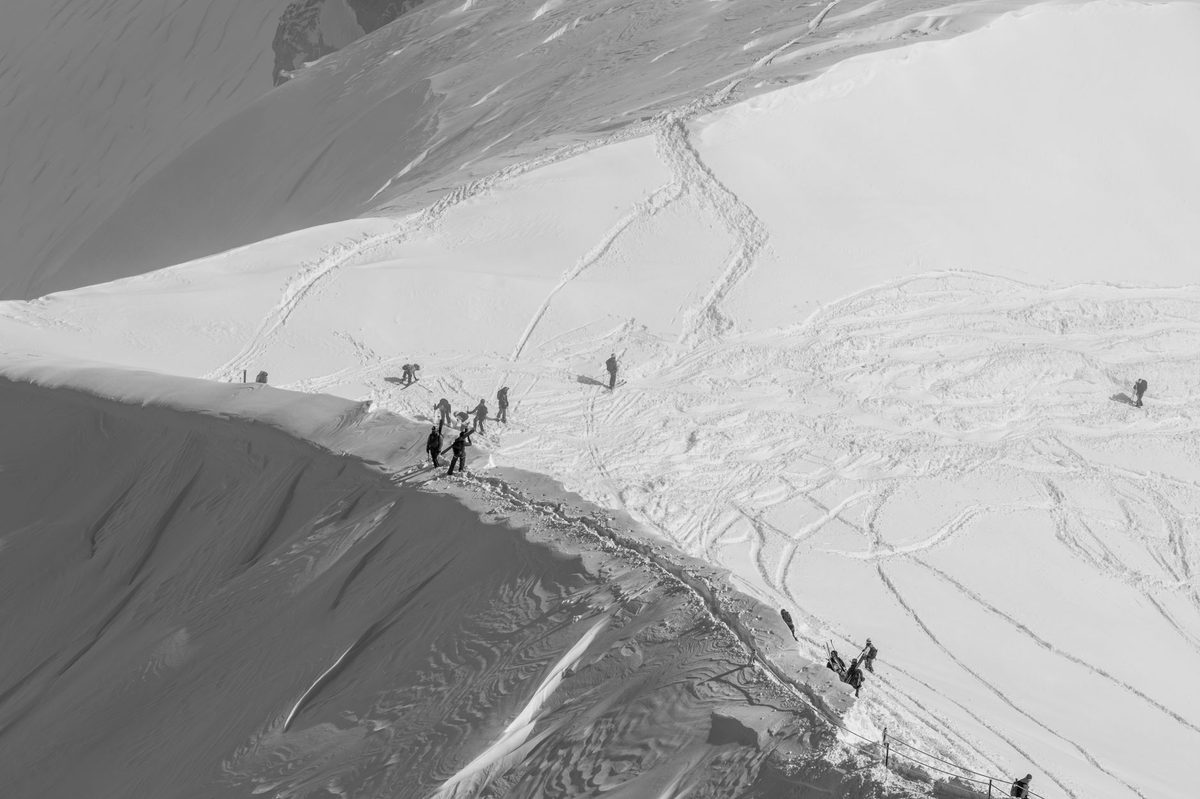 A skier on an Alpine slope, the kind of Geneva day trip that needs ski travel insurance