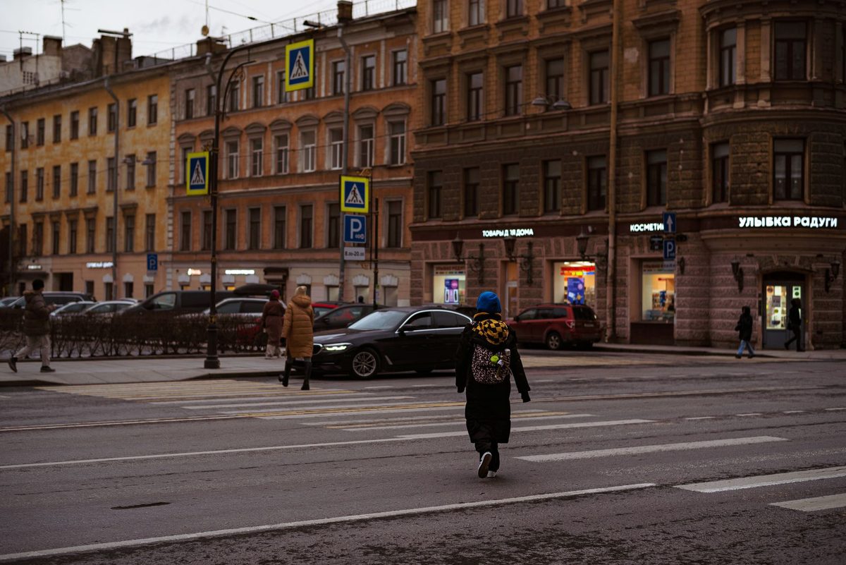 A solo traveller walking a Geneva street by day, where street harassment is rare