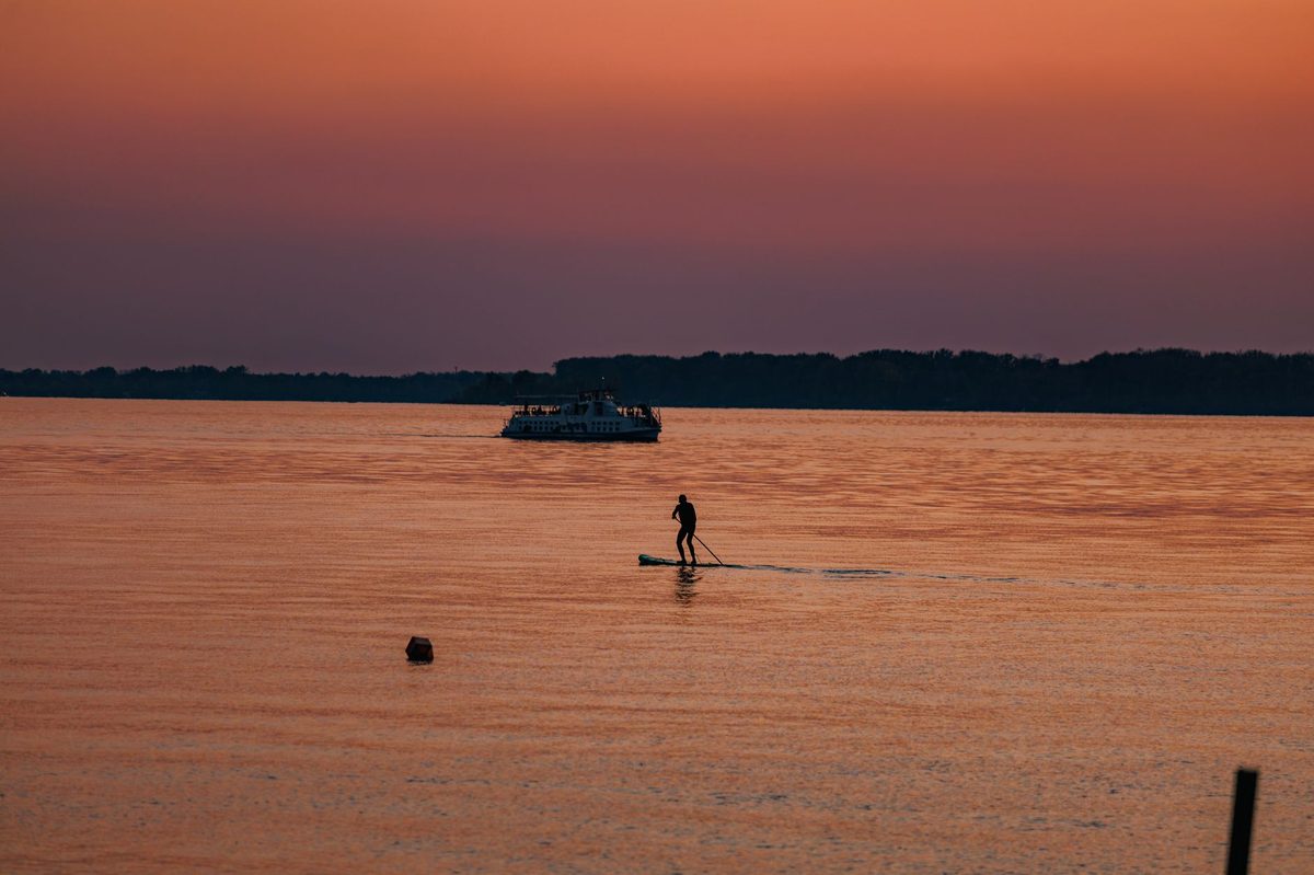 Sunset paddleboarding on Lake Geneva on a long summer evening