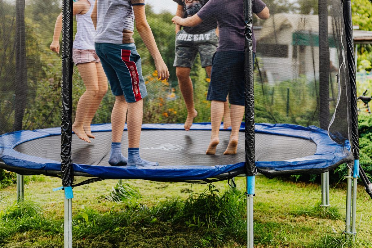 Kids at an indoor trampoline park near Geneva on a rainy day