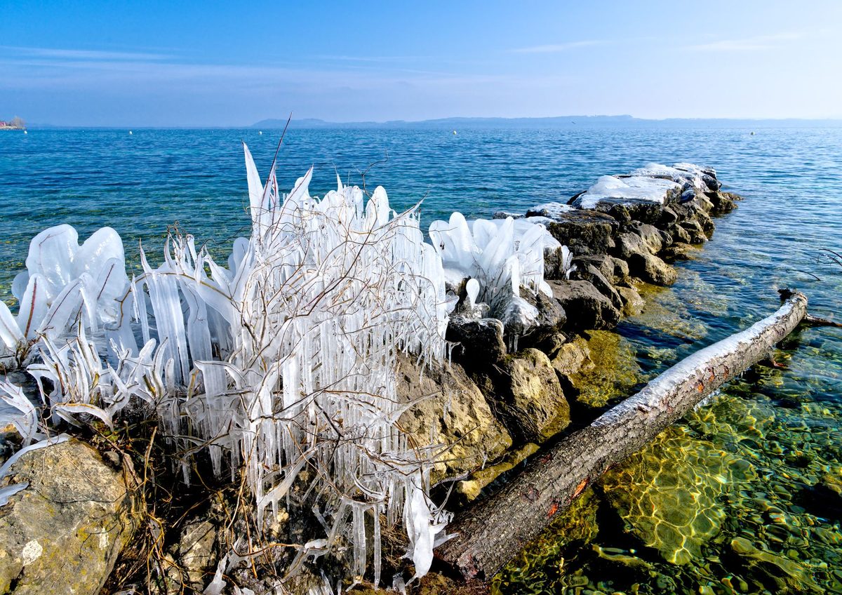 Lakefront railings iced over by the Bise wind in Geneva winter