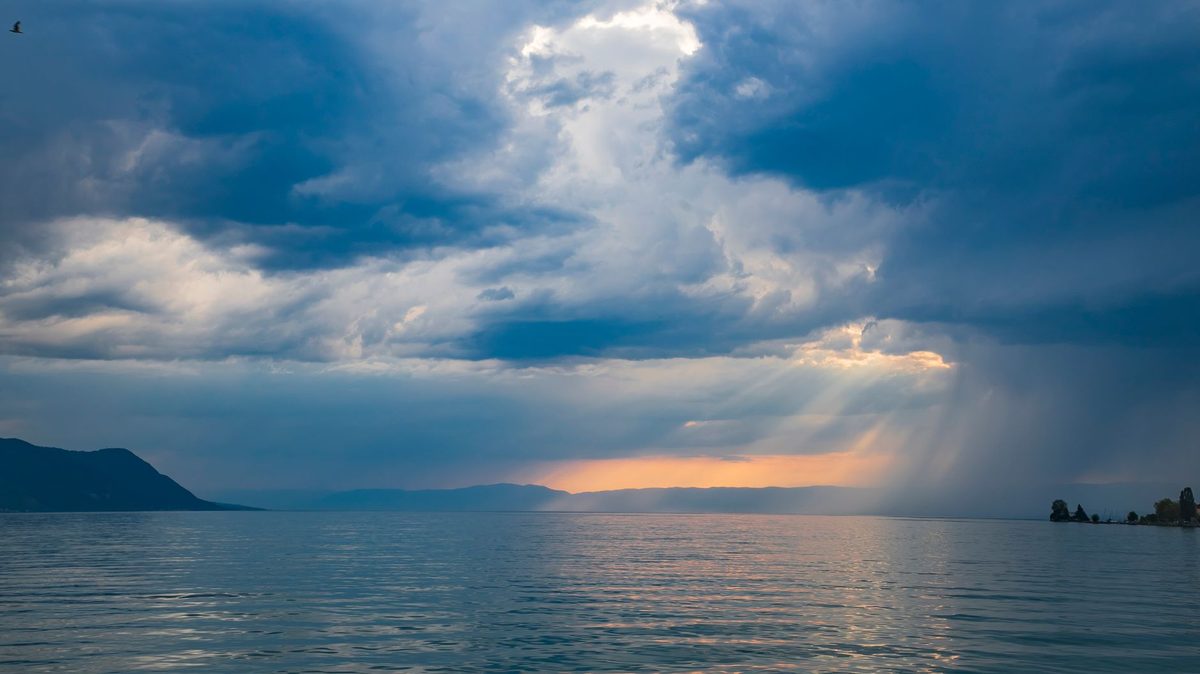 Summer thunderstorm clouds building over Lake Geneva