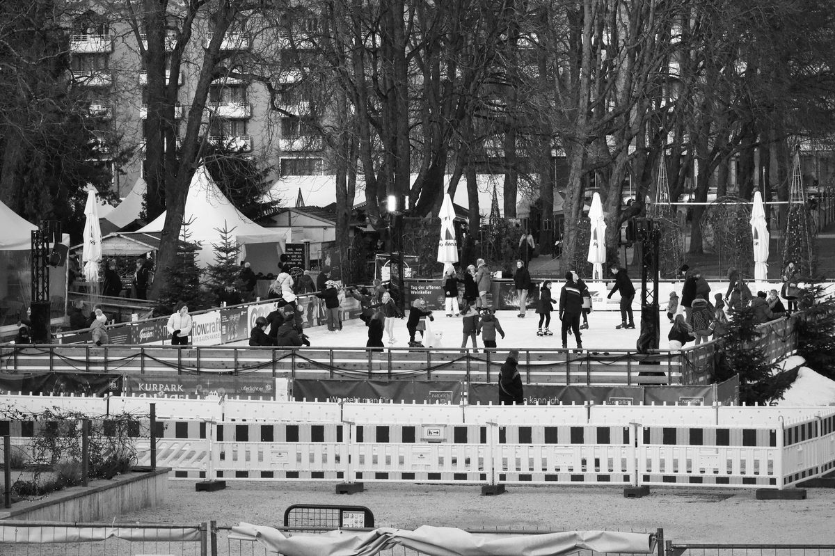 Outdoor ice skating rink in a Geneva park during winter