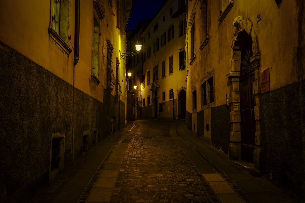 Narrow medieval street in Geneva's Old Town outside Maison Tavel