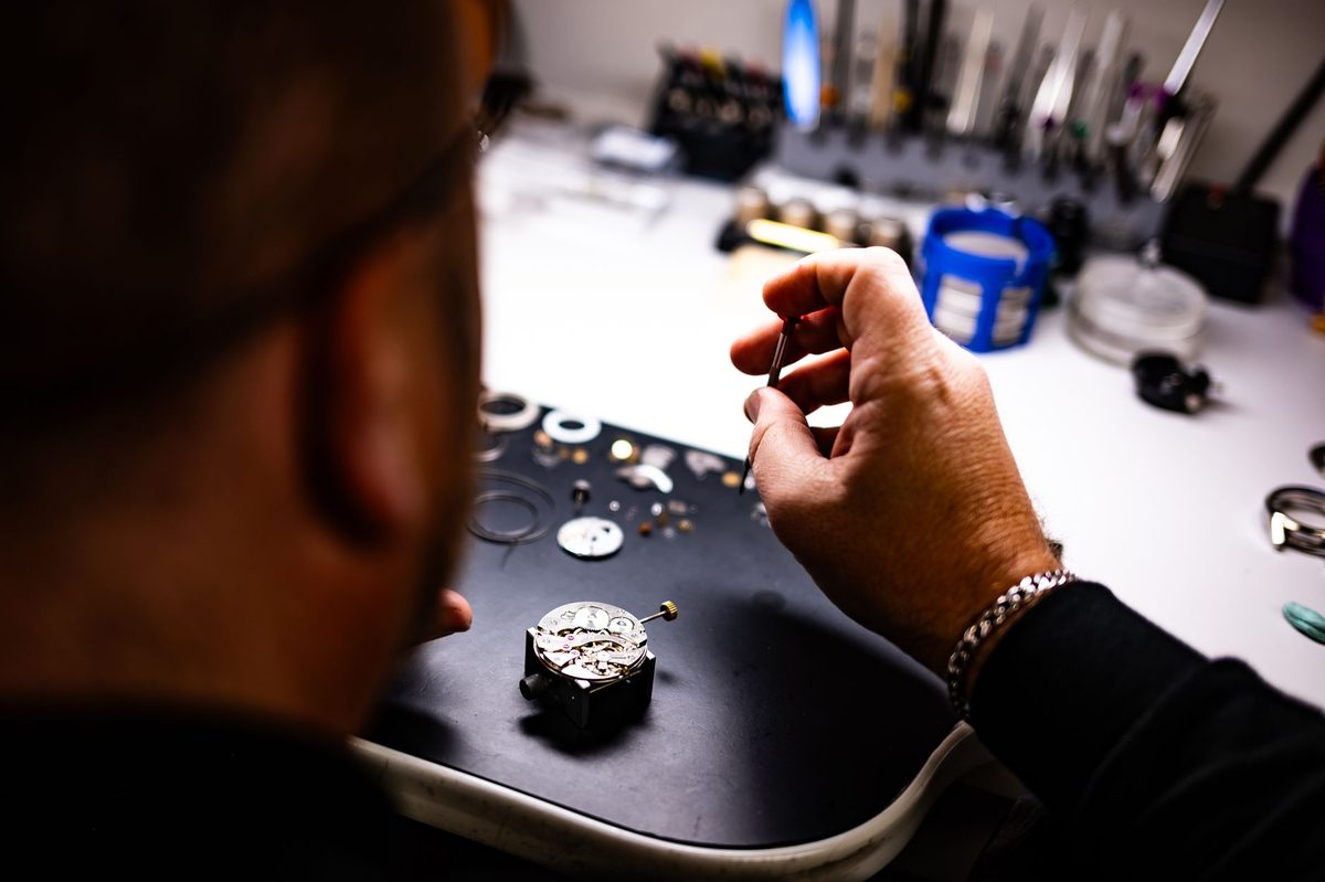 Watchmaker at work, like the restoration workshop visible at the Patek Philippe Museum Geneva