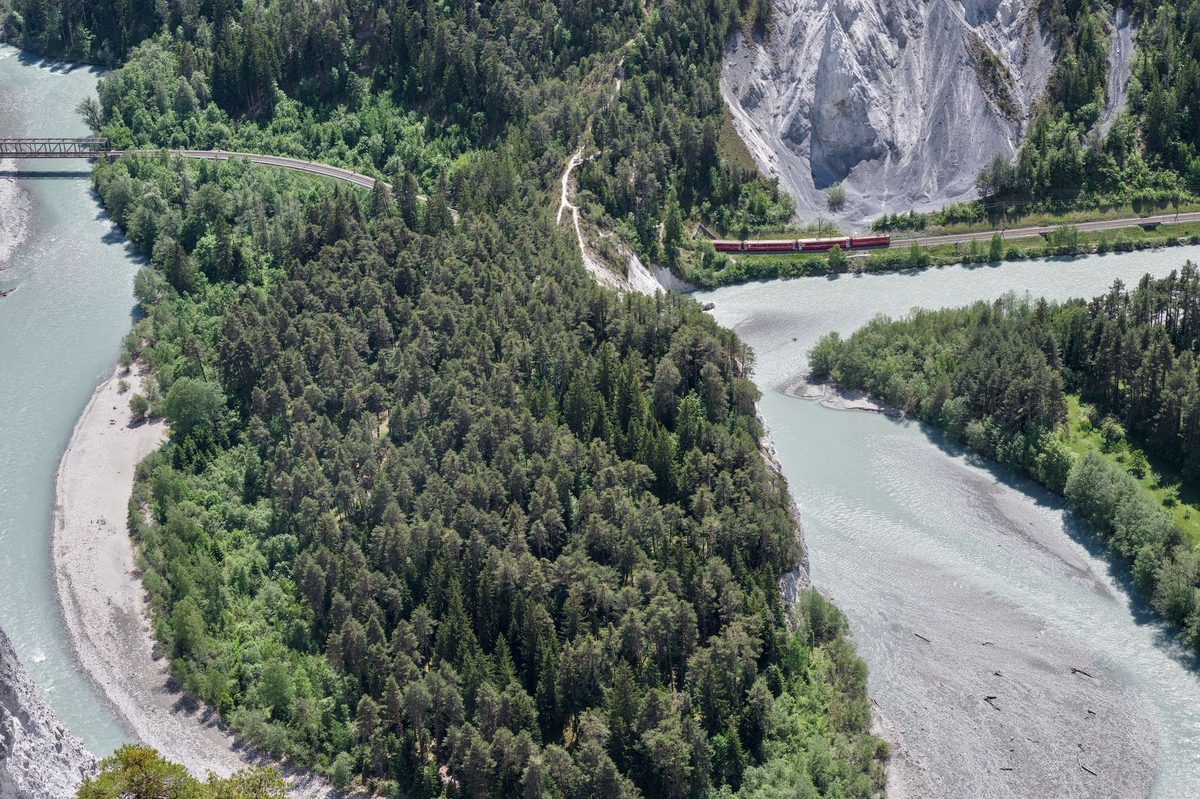 A panoramic Swiss train through the Alps, the kind covered by the Swiss Travel Pass from Geneva