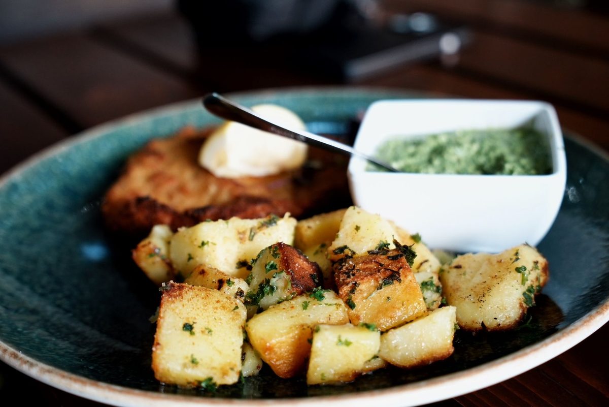 Traditional Swiss food in Geneva, a crisp golden rösti potato cake