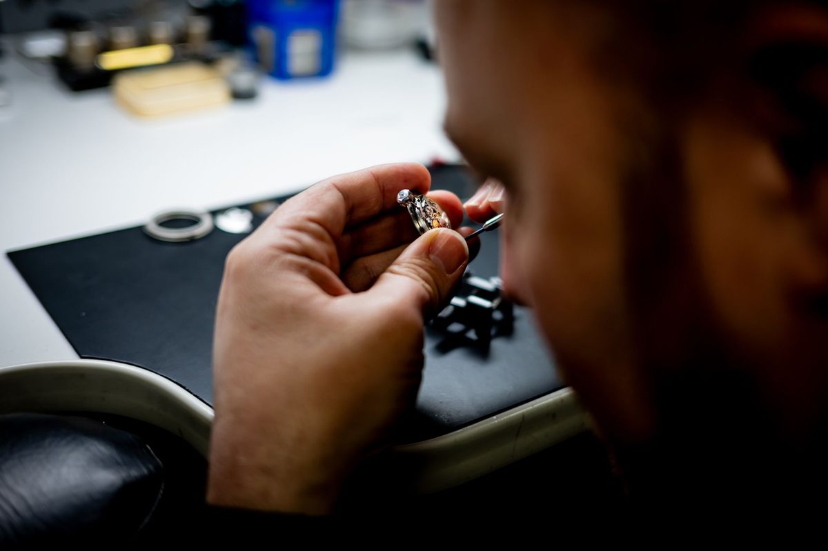 Watchmaker assembling a movement in a Geneva atelier