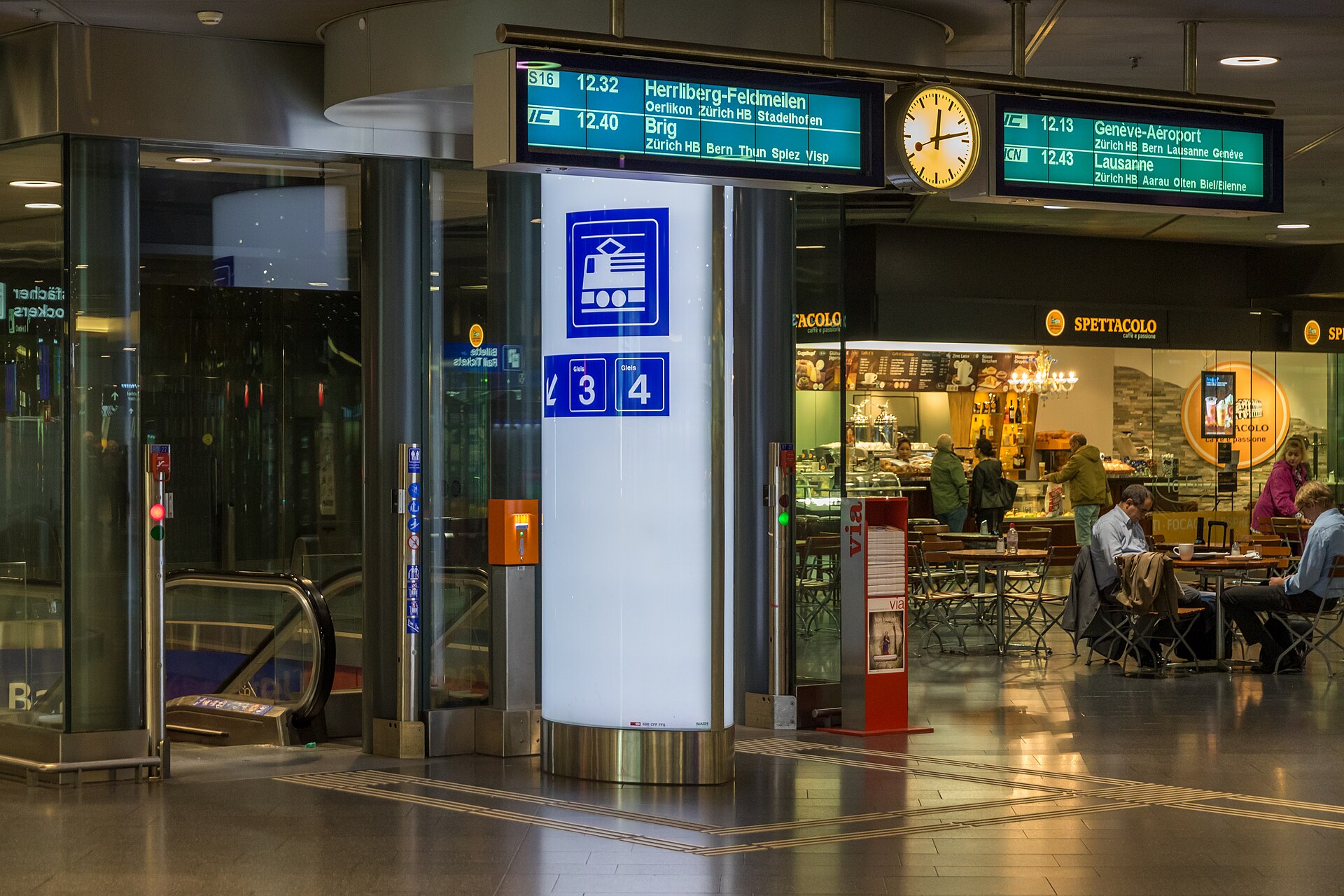 Departure boards at Zurich Airport railway station showing an InterCity train to Genève-Aéroport
