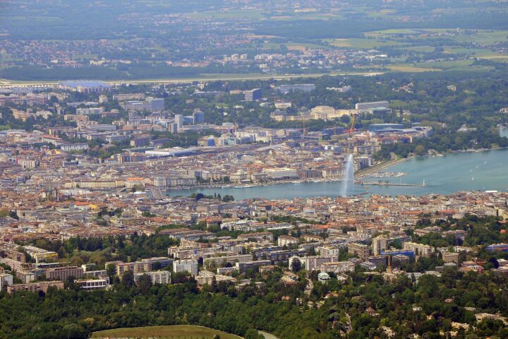 Geneva seen from the Saleve with the lake, the Jet d'Eau and the airport runway in one view