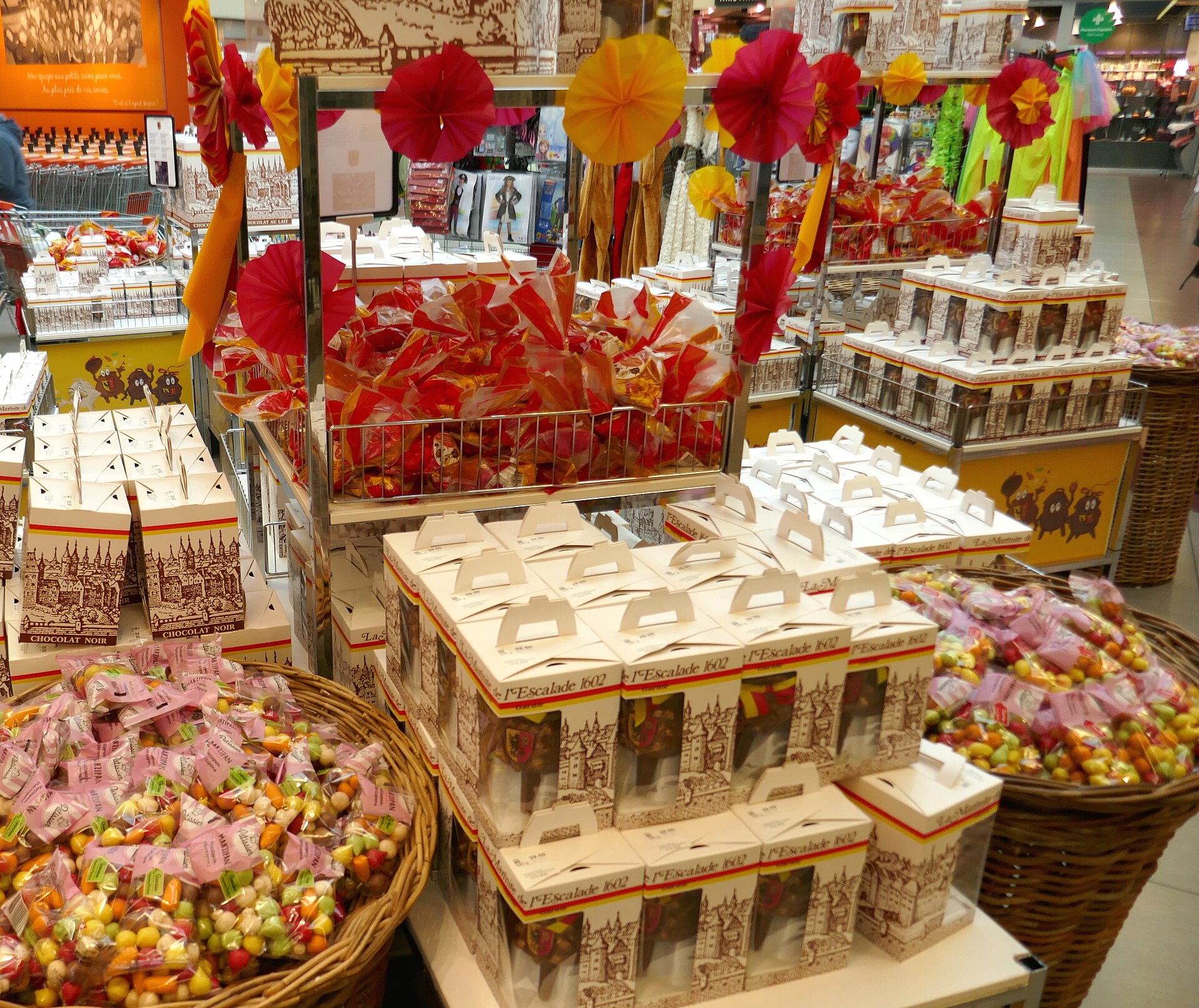 Boxed chocolate marmites de l'Escalade and bags of marzipan vegetables on display in a Geneva supermarket