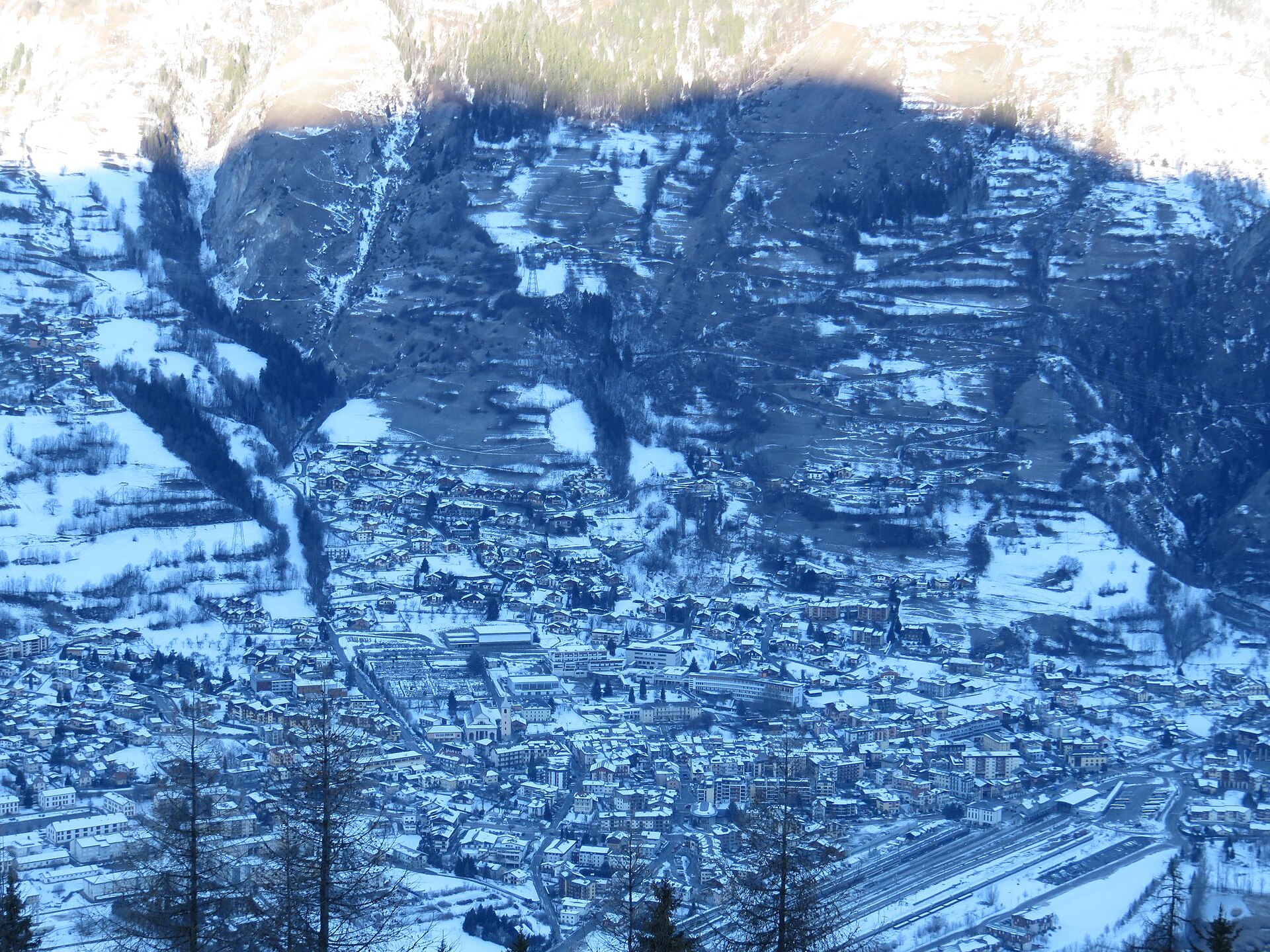 The town of Bourg-Saint-Maurice under snow in the Tarentaise valley with its railway yard visible
