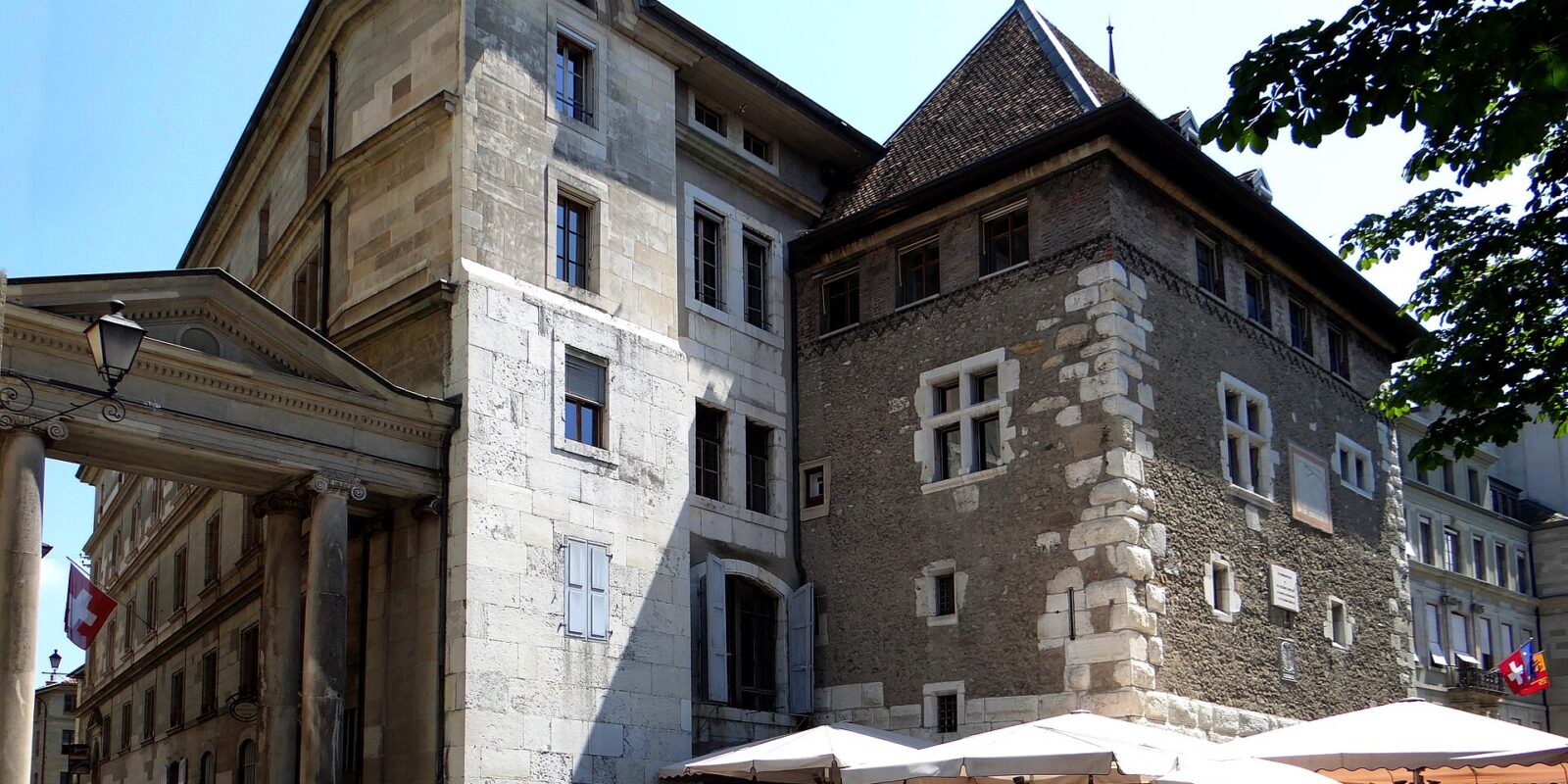 Café Papon's parasol-covered terrace sits beneath the stone Tour Baudet beside Geneva's City Hall.